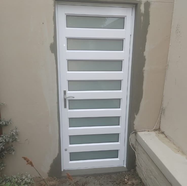 Hinge Door – Single hinge door divided into 7 panes with white translucent glass