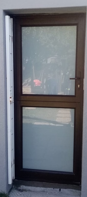 Stable Door – Bronze stable door with translucent white glass top and bottom