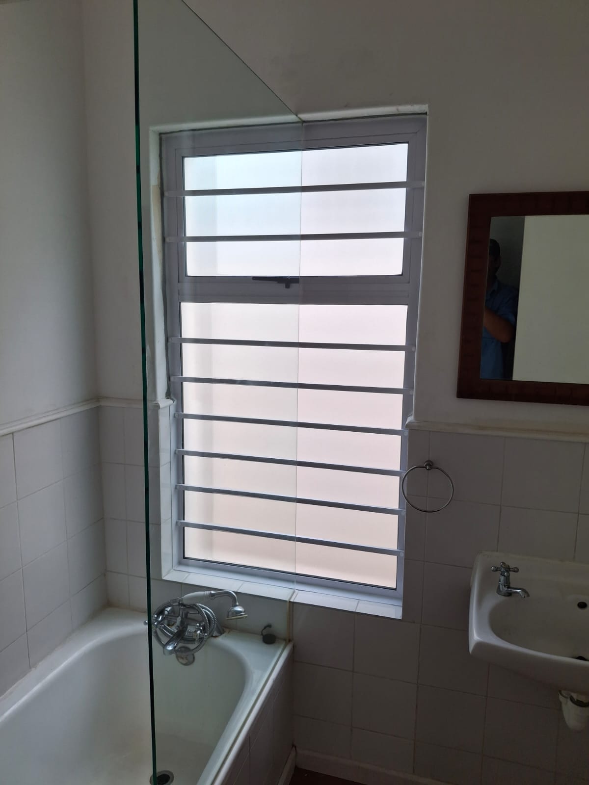 Window – PT window with obscure glass and full aluminium burglar bar coverage